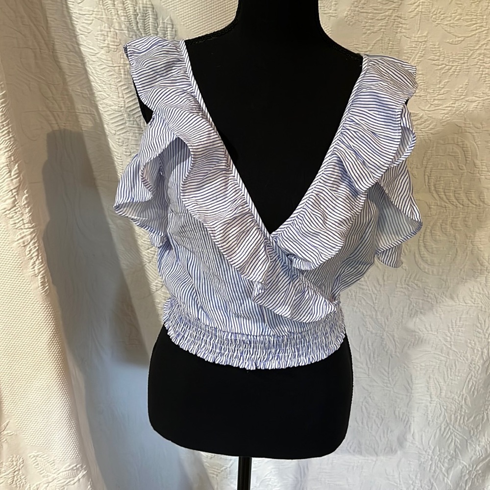 a.peach ruffle‎ top, size small